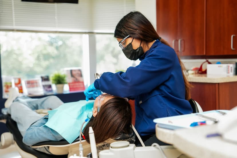 Dental hygienist providing care